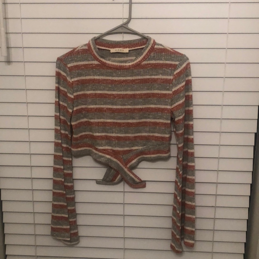 small grey red and white striped cropped long sleeve. lightly used